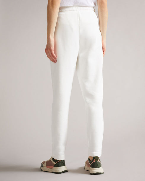 DORRINE-Trousers-A classic pair of jersey joggers are a wardrobe staple. Offering the best in comfort, DORRINE will take you from a workout to elevated loungewear without missing a beat. An embroidered magnolia and constrasting drawstring complete the look for a tried and true modern style. Ted Baker womenswear collection Jersey joggers Magnolia branding Elasticated drawstring waist Stretch fabric Our model is 5'9"/ 1.75m and wears a Ted size 1- Ted Baker Romania